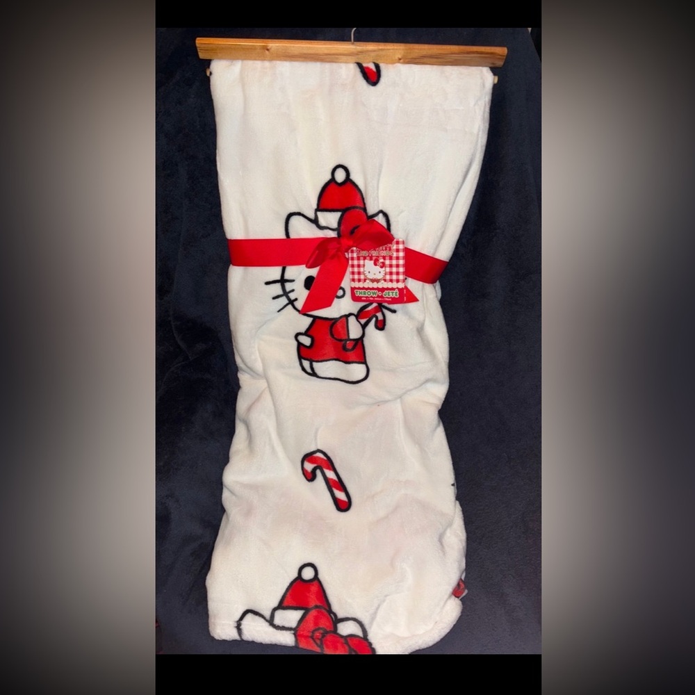First offer gets it. Hello Kitty Christmas candy cane blanket. - Picture 1 of 2